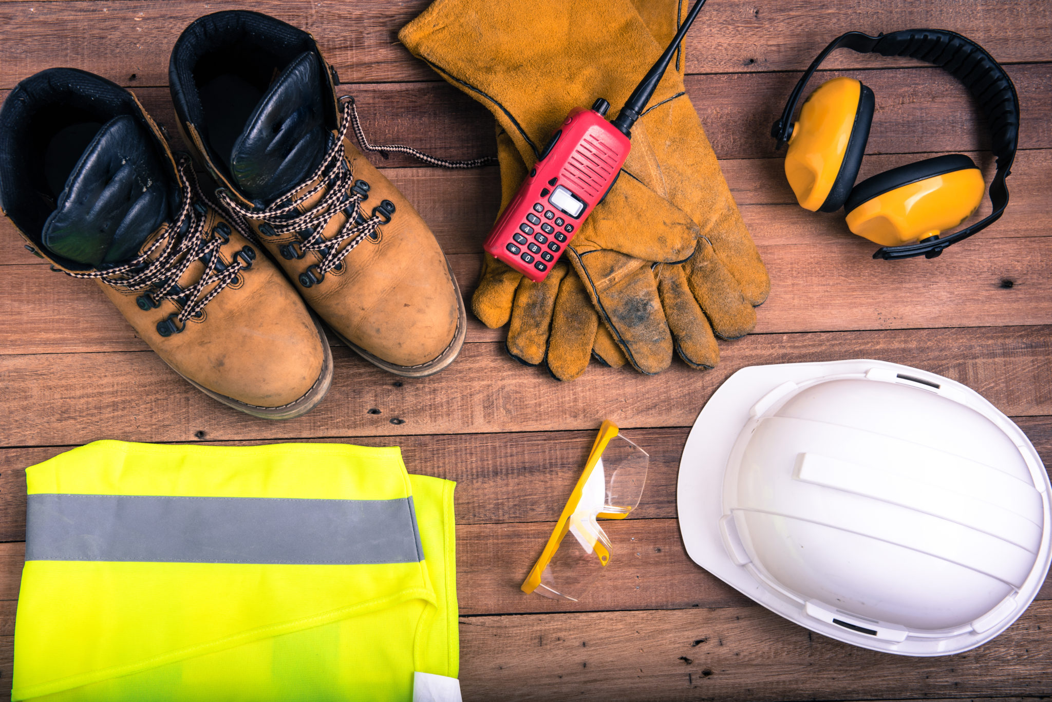 helmet, reflector jacket, gloves, safety shoe, showing the concept of workplace