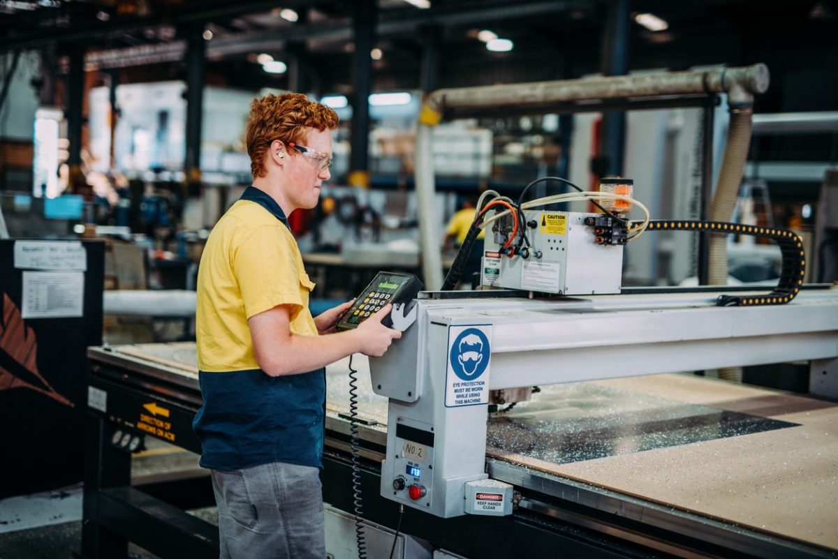 a man maintaining an industrial equipment